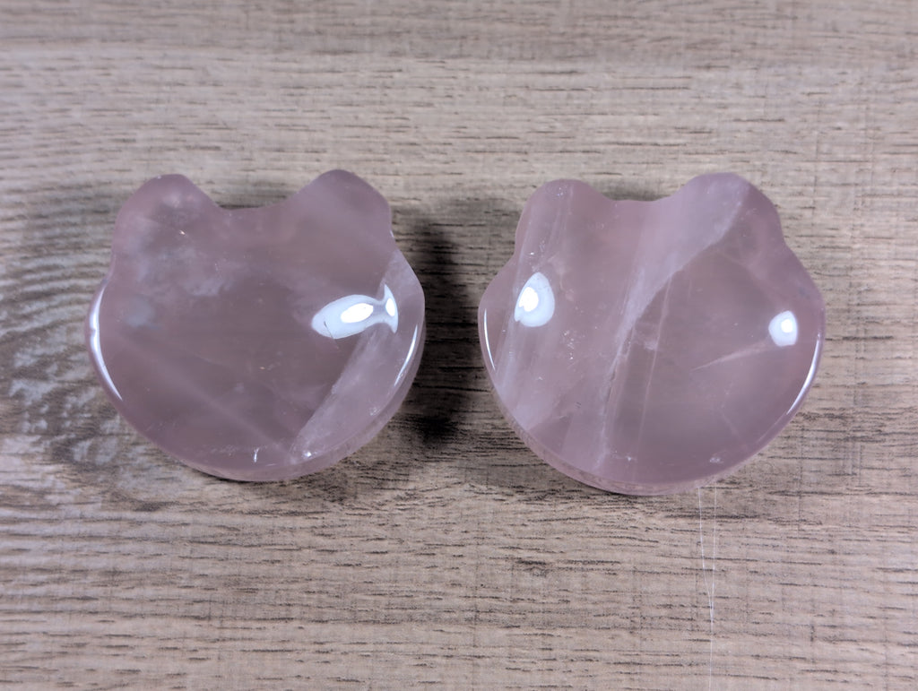 Teddy bear head-shaped rose quartz bowl from Syn's Crystal Co, featuring smooth pink crystal with detailed bear facial features.