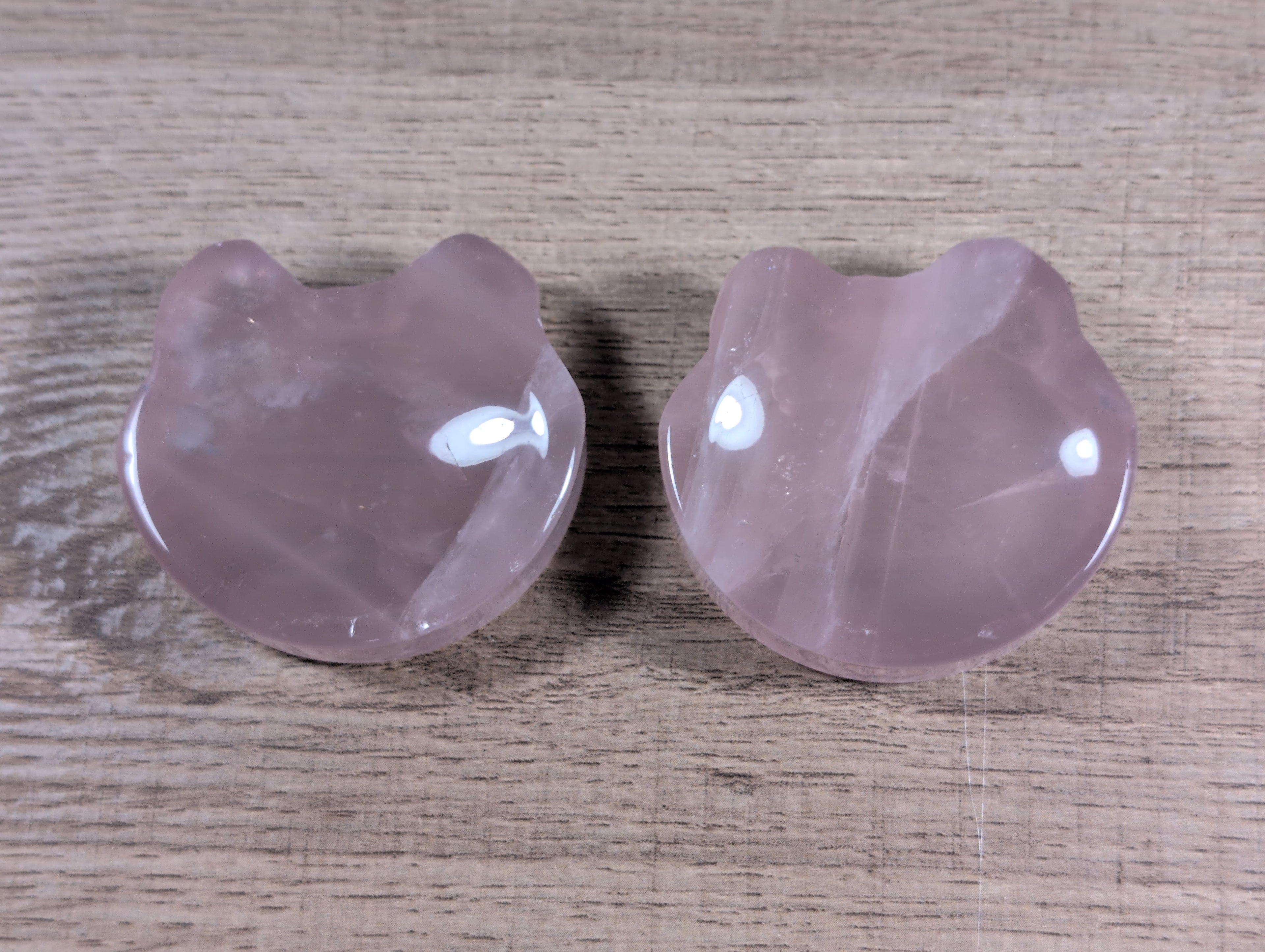 Teddy bear head-shaped rose quartz bowl from Syn's Crystal Co, featuring smooth pink crystal with detailed bear facial features.