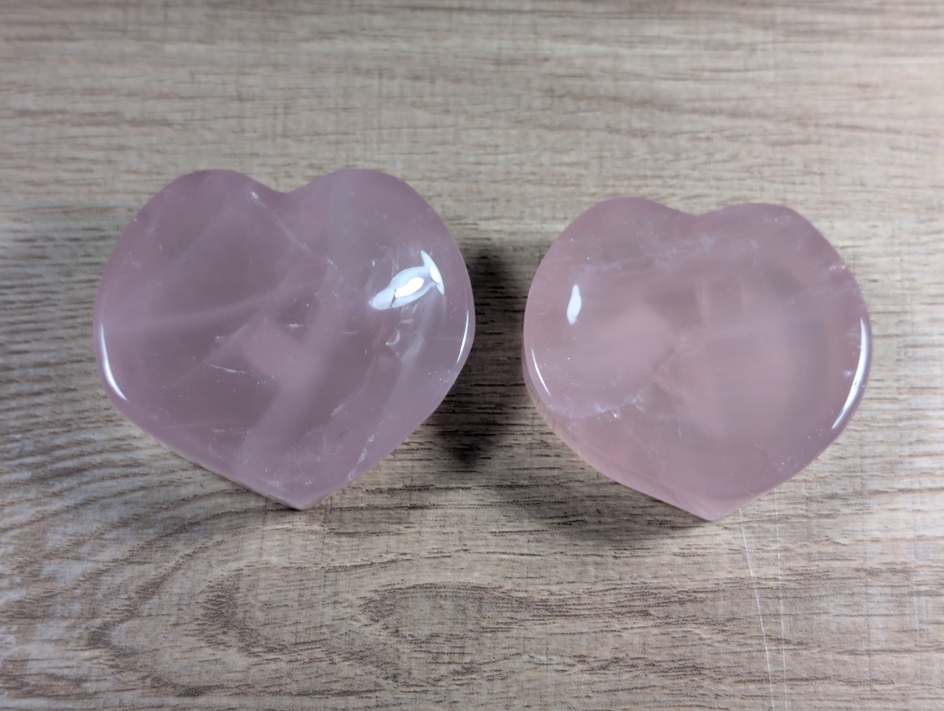 Heart-shaped rose quartz bowl from Syn's Crystal Co, showcasing a smooth, pink gemstone with a polished finish.