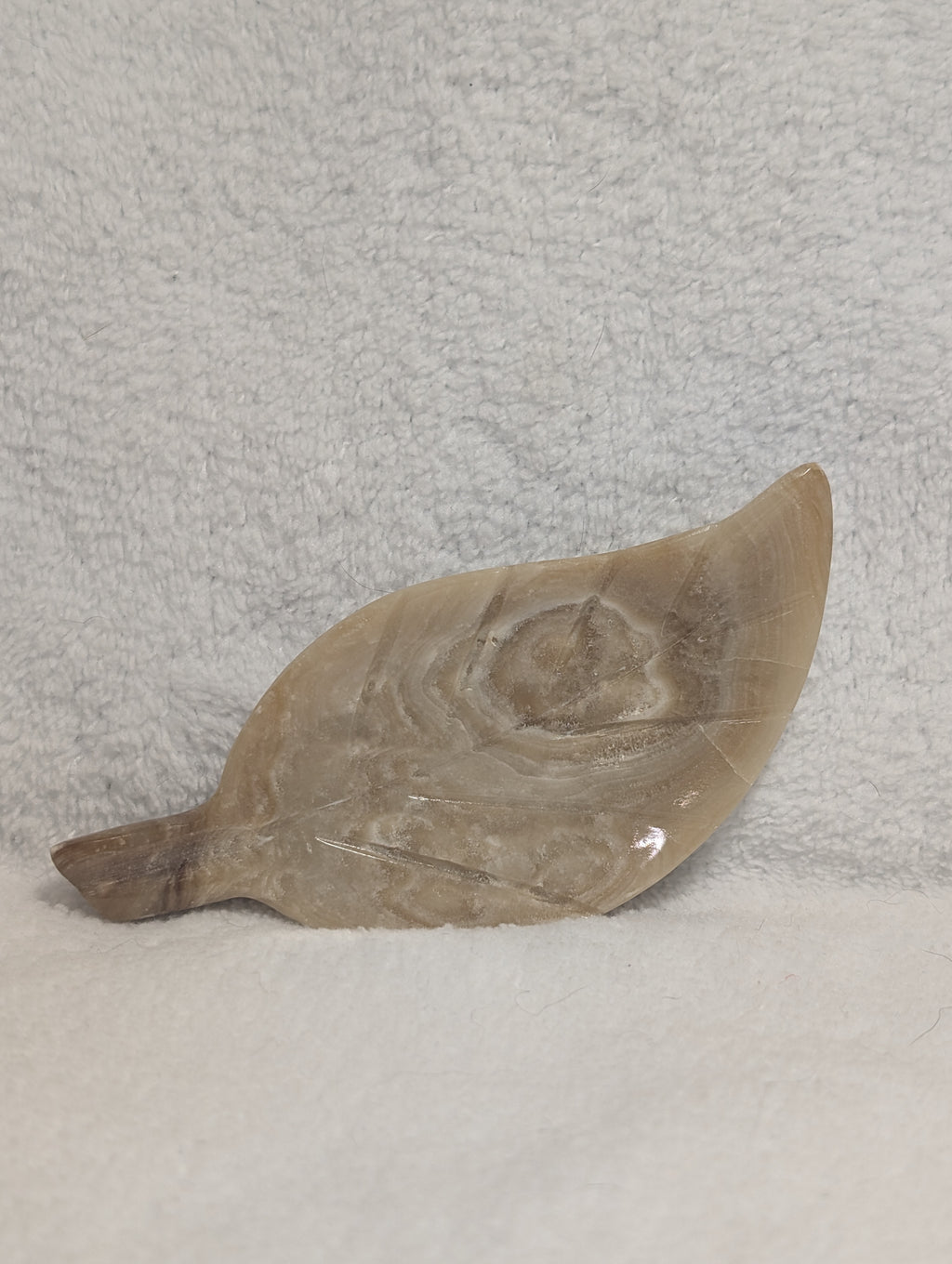 Chocolate Calcite Leaf carving by Syn's Crystal Co showing a detailed leaf shape with rich brown and tan tones.