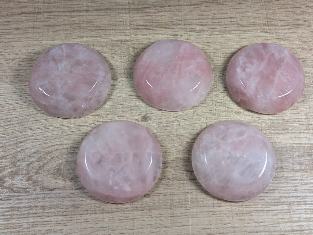 Round rose quartz bowl by Syn's Crystal Co showing smooth, polished pink stone with natural gemstone appearance.