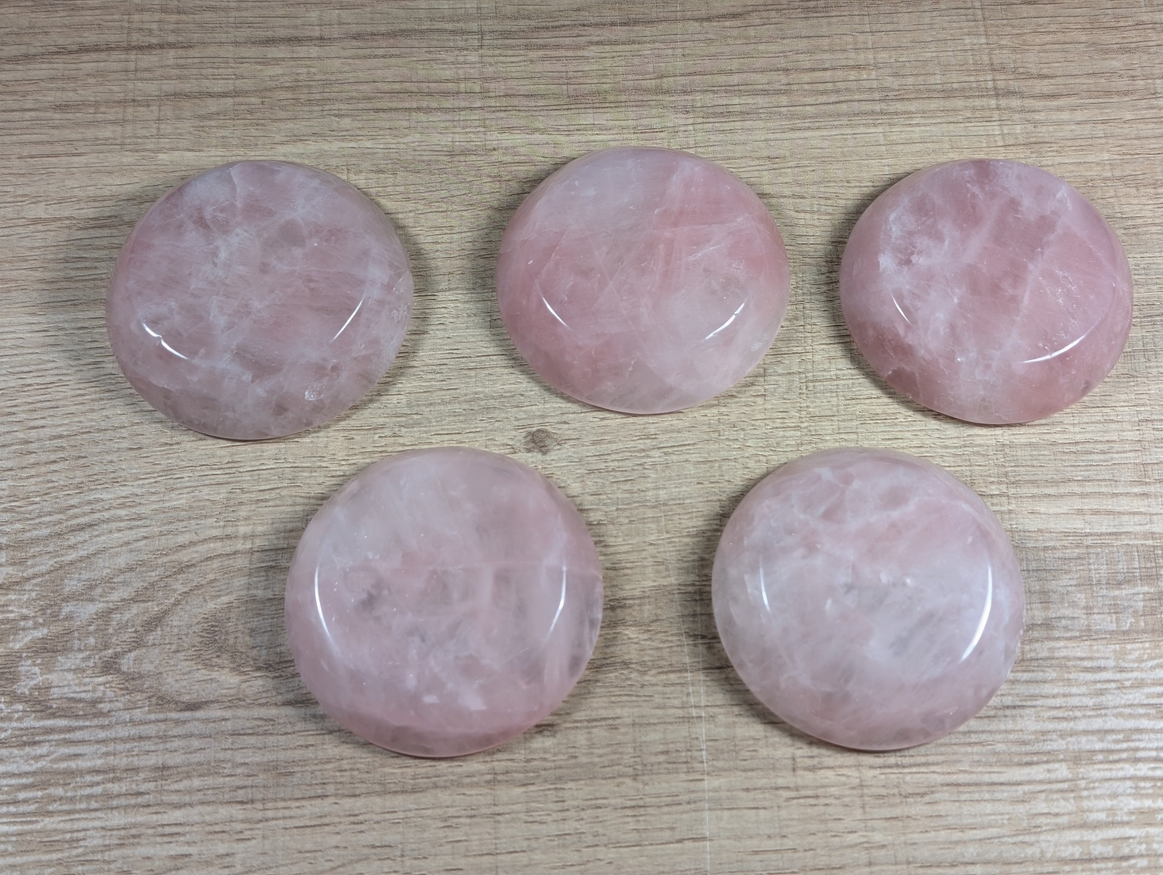 Round rose quartz bowl by Syn's Crystal Co showing smooth, polished pink stone with natural gemstone appearance.