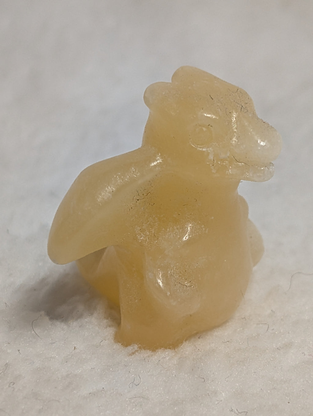 Mini Charizard Pokémon carving by Syn's Crystal Co featuring a detailed, colorful crystal sculpture of the iconic dragon Pokémon.