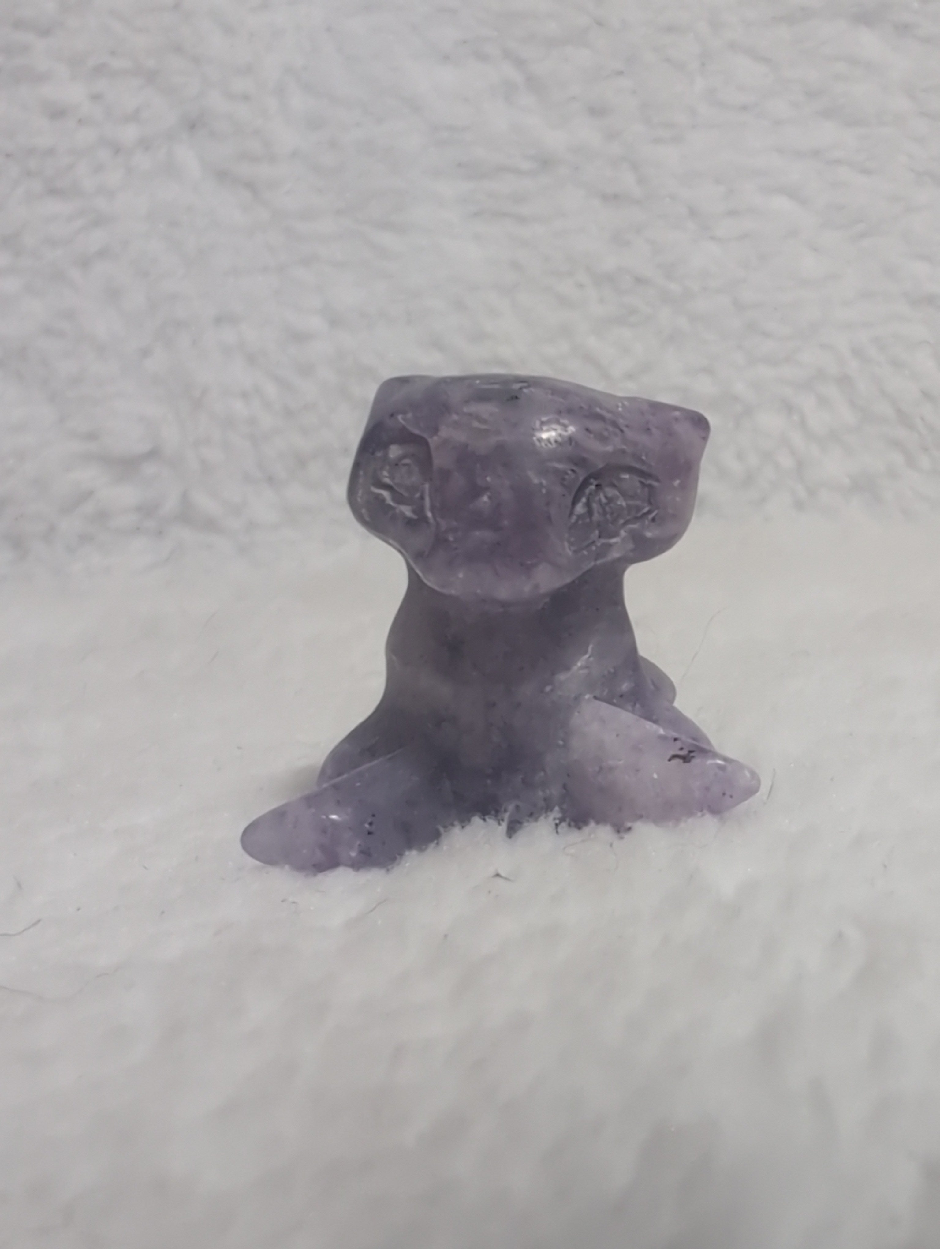 Mini Mew Pokemon carving from Syn's Crystal Co, featuring detailed crystal craftsmanship on a small, colorful figurine.