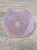 Rose quartz bowl shaped like a teddy bear head, crafted by Syn's Crystal Co, featuring smooth, pink gemstone details.