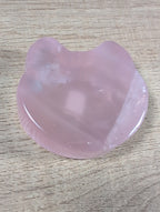 Rose quartz bowl shaped like a teddy bear head, crafted by Syn's Crystal Co, featuring smooth, pink gemstone details.