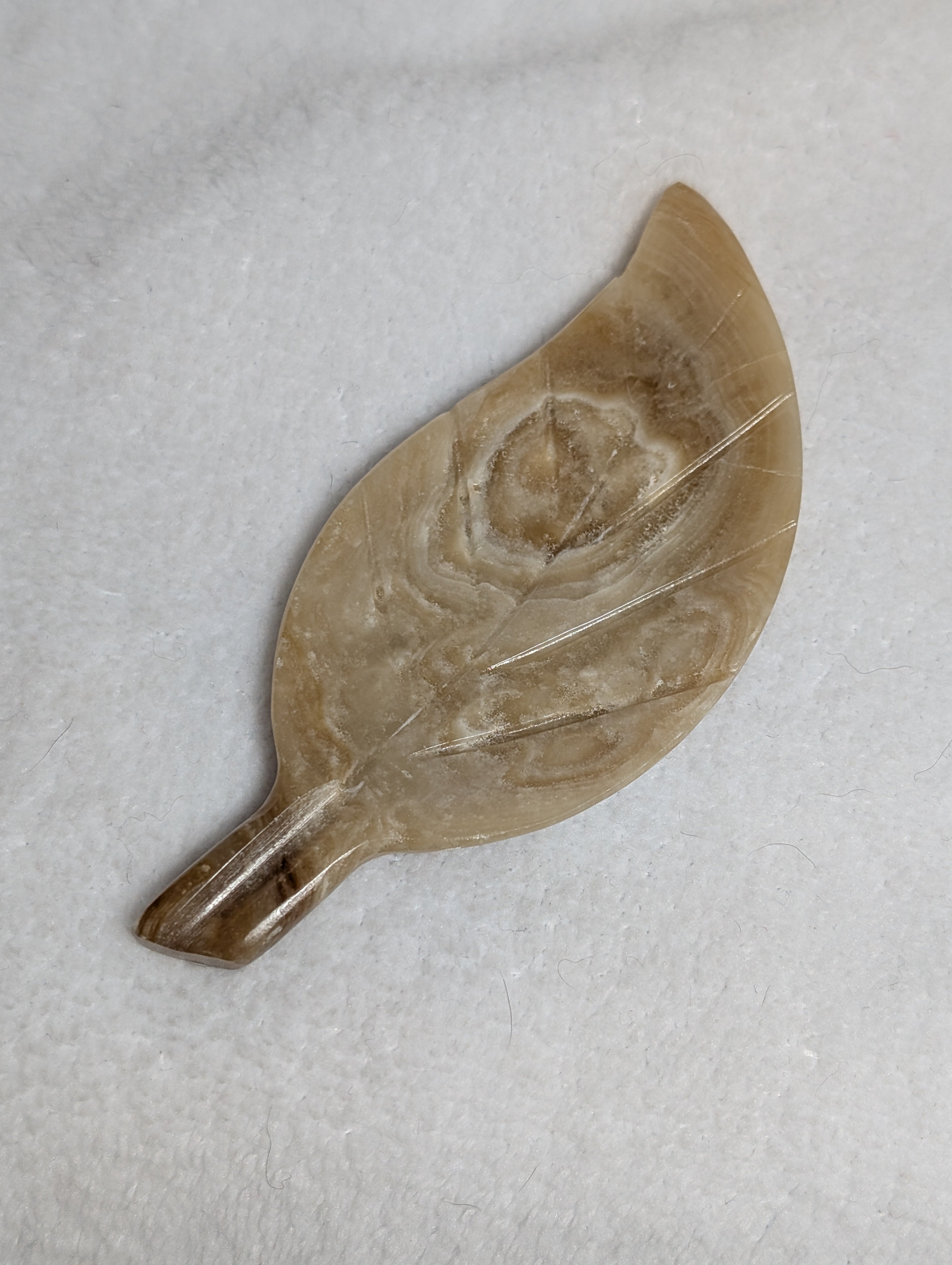 Chocolate Calcite Leaf carving by Syn's Crystal Co featuring detailed leaf design and rich brown coloring.