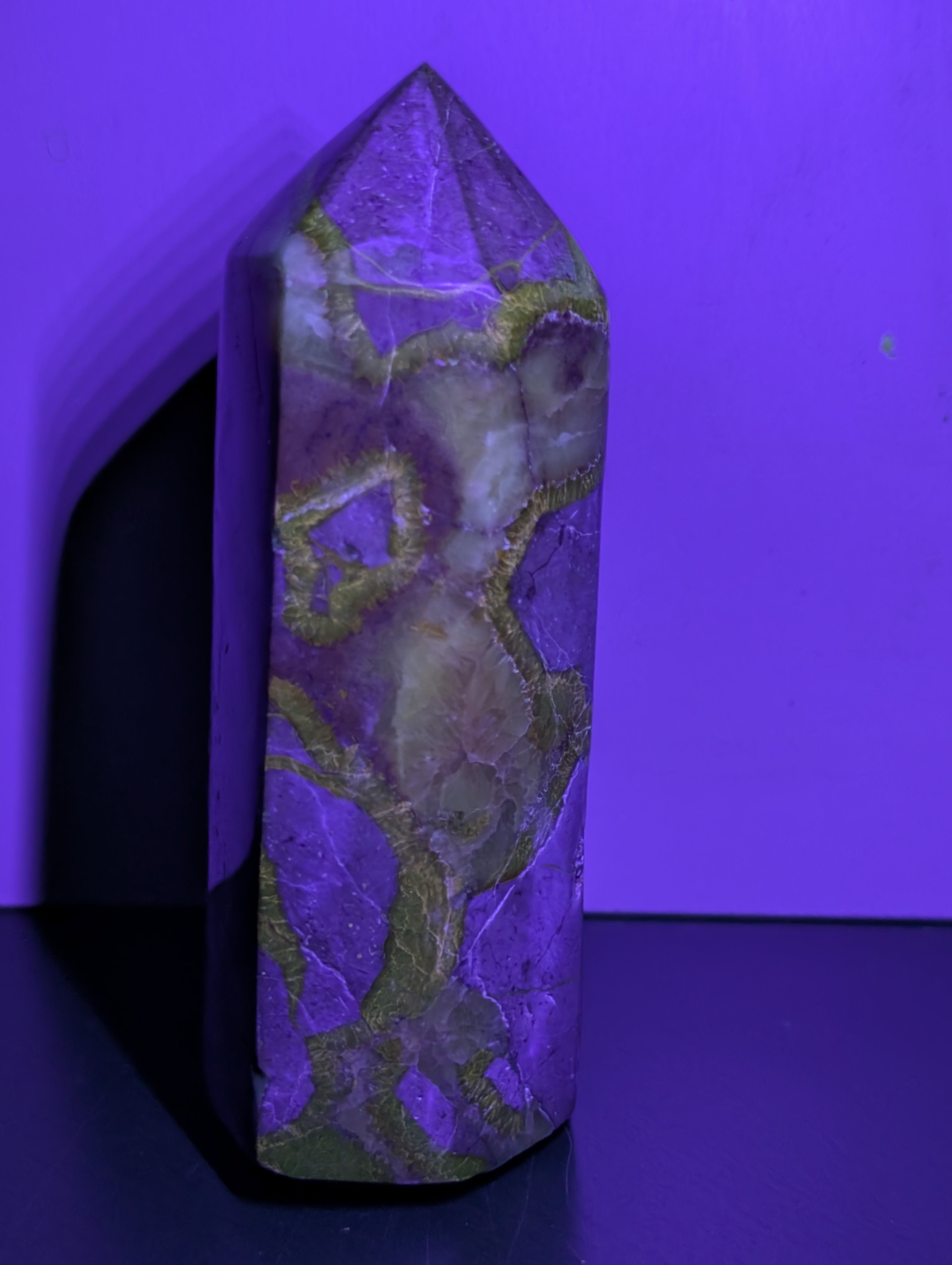 Septarian Tower crystal from Syn's Crystal Co featuring earthy brown and yellow mineral patterns on a polished stone surface.