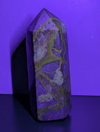 Septarian tower crystal from Syn's Crystal Co showcasing earthy brown and yellow mineral patterns on a polished stone.