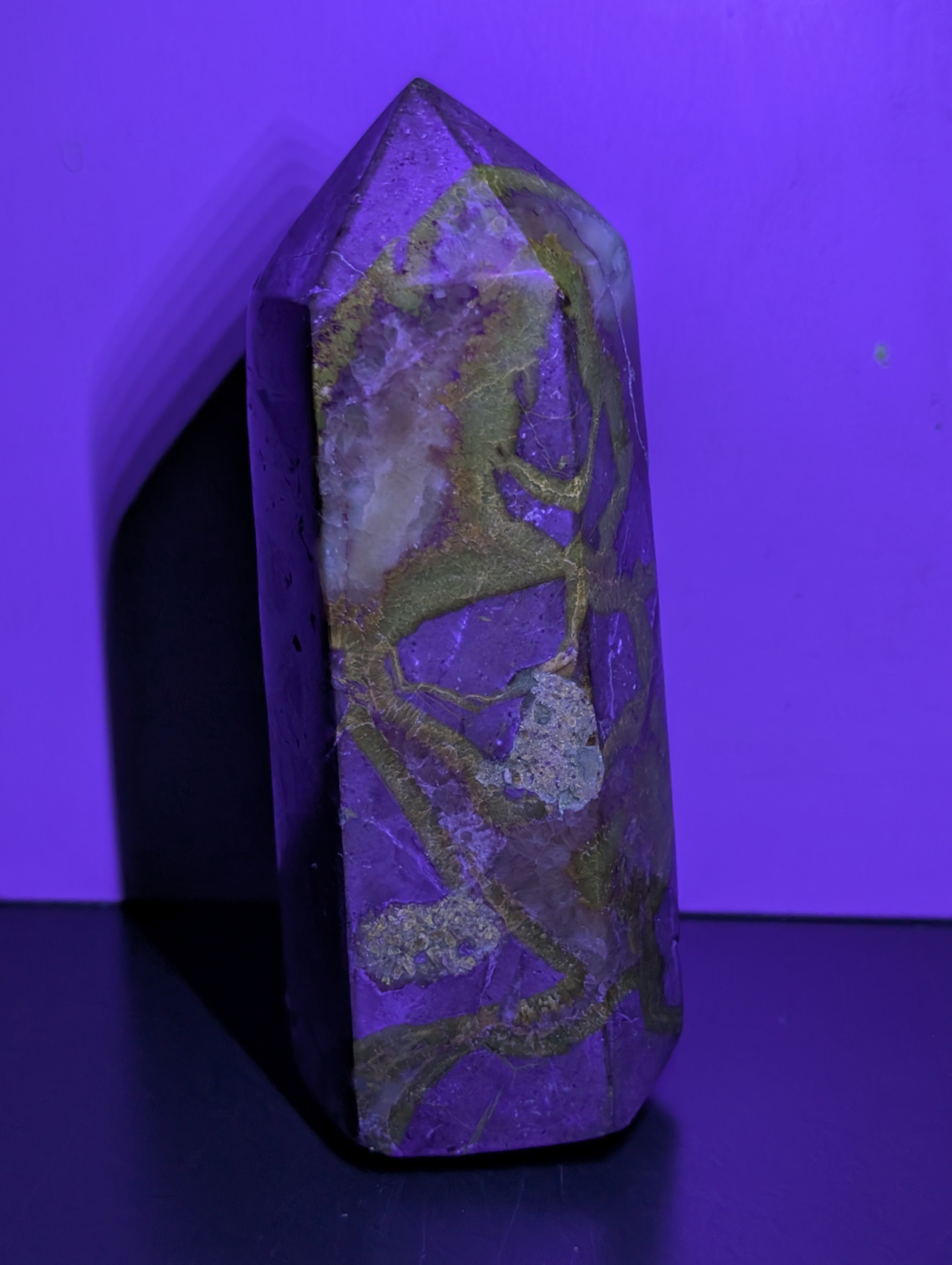 Septarian tower crystal from Syn's Crystal Co showcasing earthy brown and yellow mineral patterns on a polished stone.