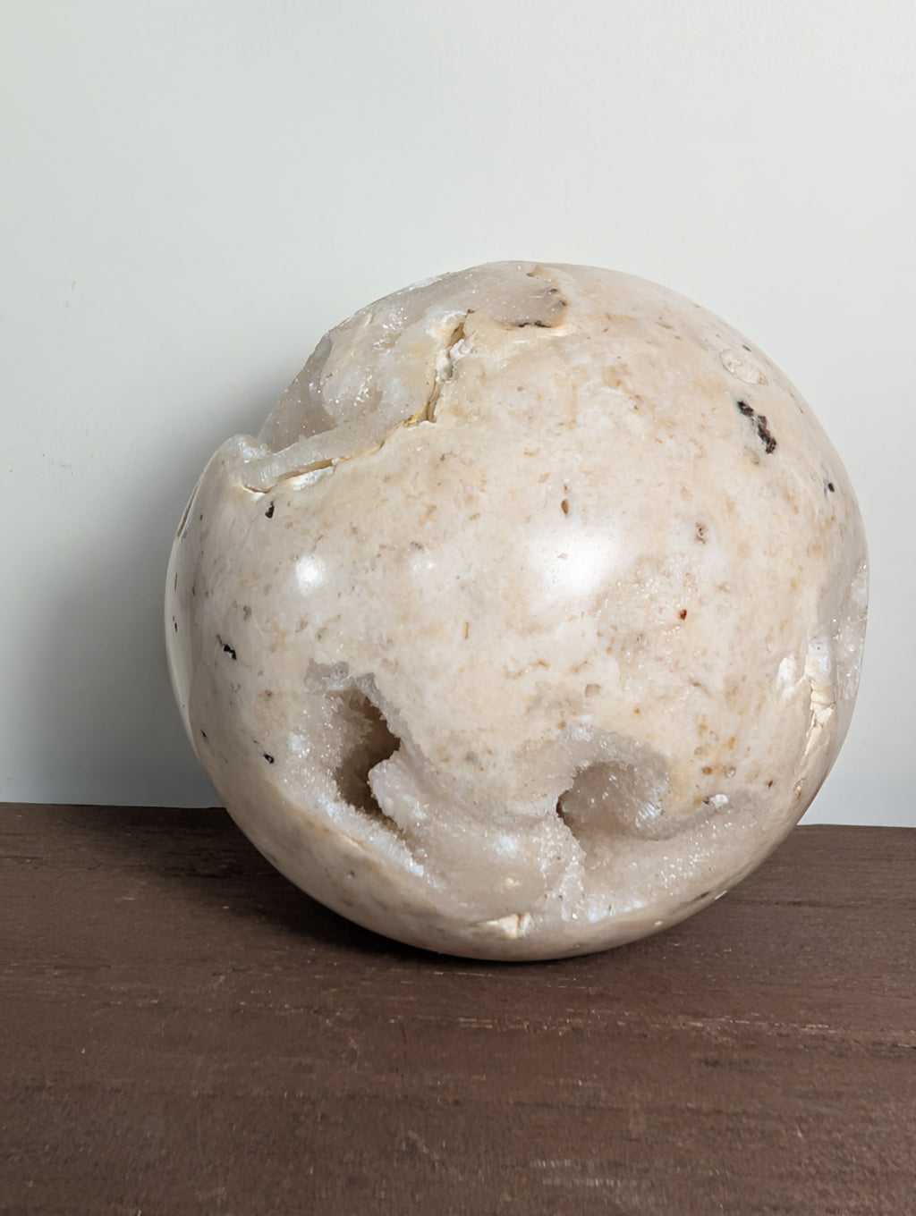 Druzy sphere from Syn's Crystal Co featuring sparkling quartz with a textured, glittering surface in natural mineral tones.