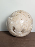 Druzy sphere from Syn's Crystal Co featuring sparkling quartz with a textured, glittering surface in natural mineral tones.