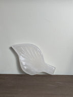 White calcite leaf carving by Syn's Crystal Co, showcasing intricate details and smooth texture in a natural, elegant design.