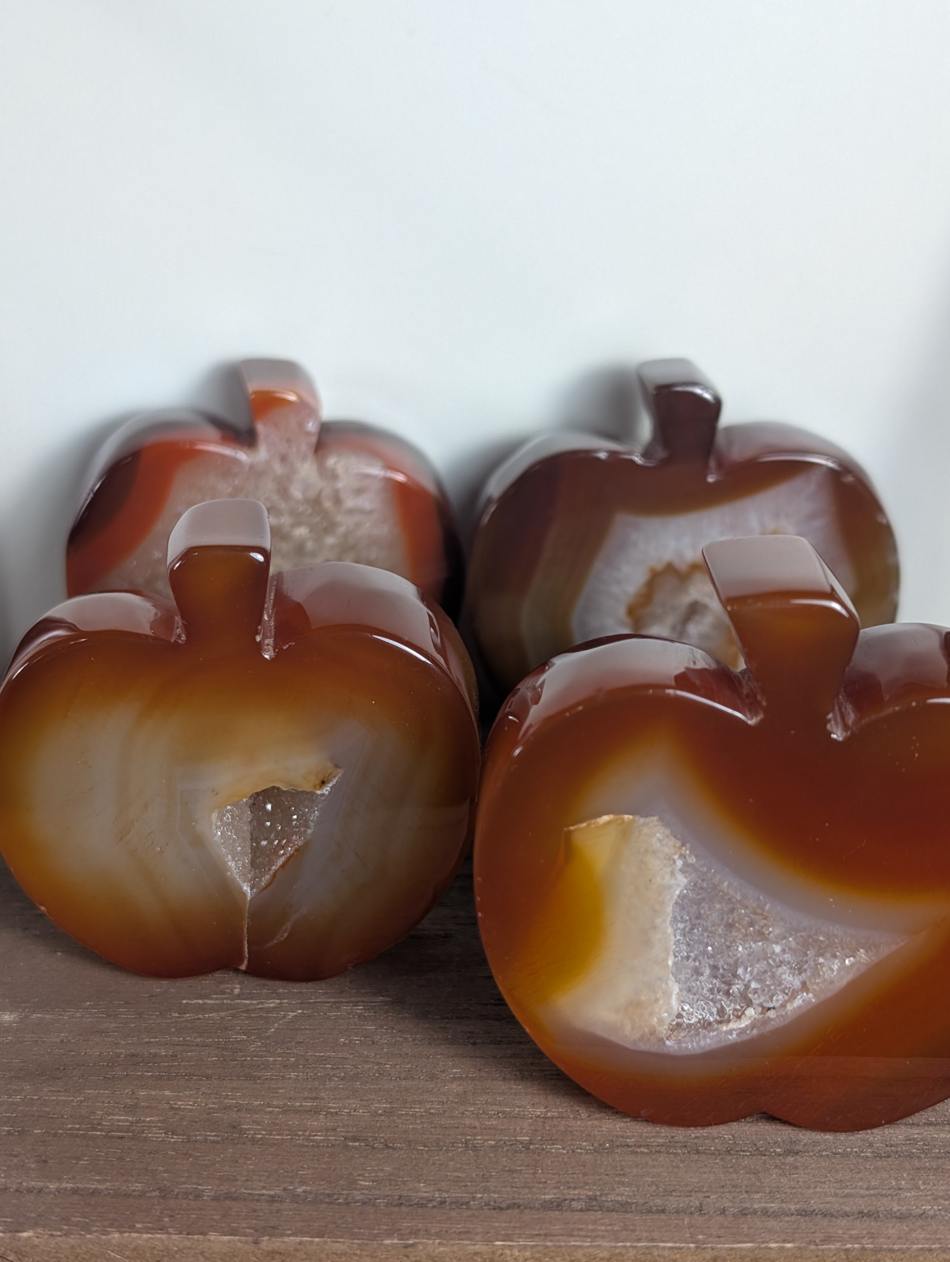 Hand-carved Carnelian Crystal Apple from Syn's Crystal Co, showcasing vibrant orange hue, smooth finish, and detailed craftsmanship.
