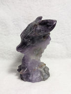 Detailed dragon head carving from Syn's Crystal Co, showcasing intricate design and craftsmanship in a natural stone sculpture.