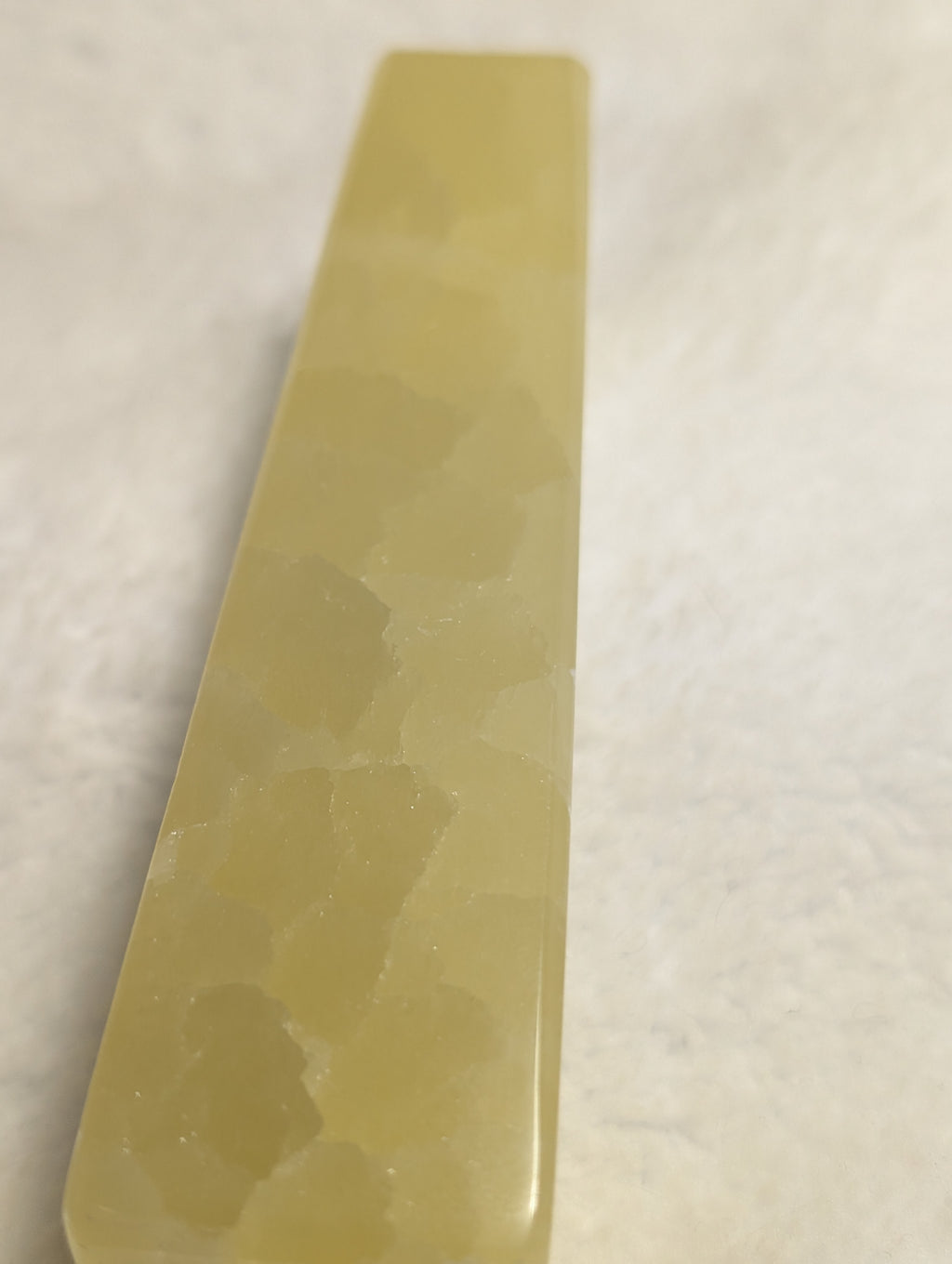 Lemon Calcite Tower by Syn's Crystal Co featuring a vibrant yellow mineral crystal with smooth polished surface.