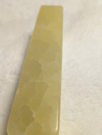 Lemon Calcite Tower by Syn's Crystal Co featuring a vibrant yellow mineral crystal with smooth polished surface.