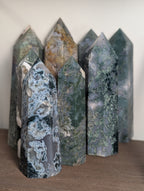 Natural moss agate crystal tower by Syn's Crystal Co, featuring intricate green and brown patterns for grounding and abundance.