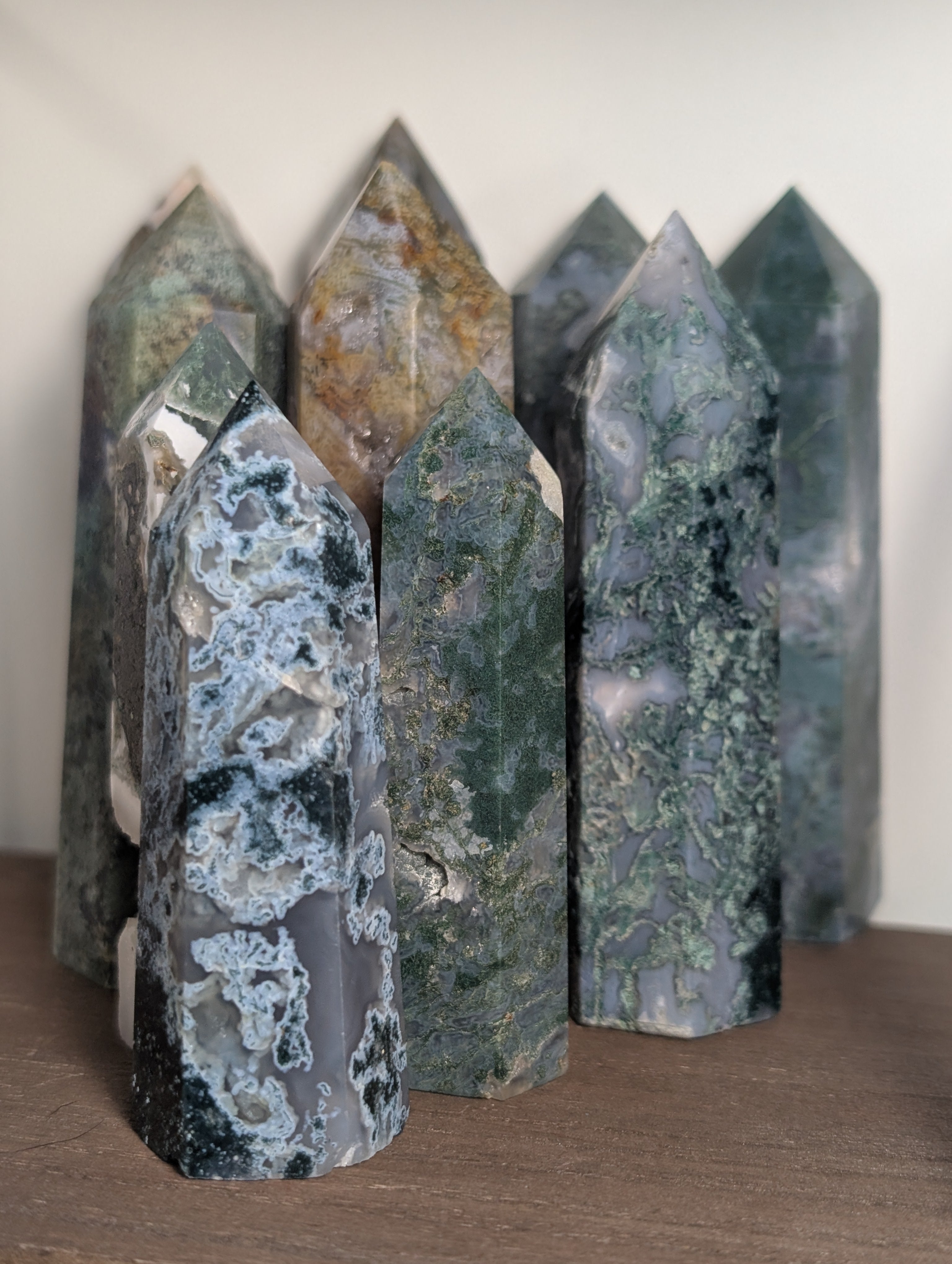 Natural moss agate crystal tower by Syn's Crystal Co, featuring intricate green and brown patterns for grounding and abundance.