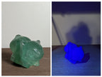 Hand-carved Bulbasaur crystal figurine by Syn's Crystal Co, featuring detailed gemstone craftsmanship for nature and heart chakra energy.
