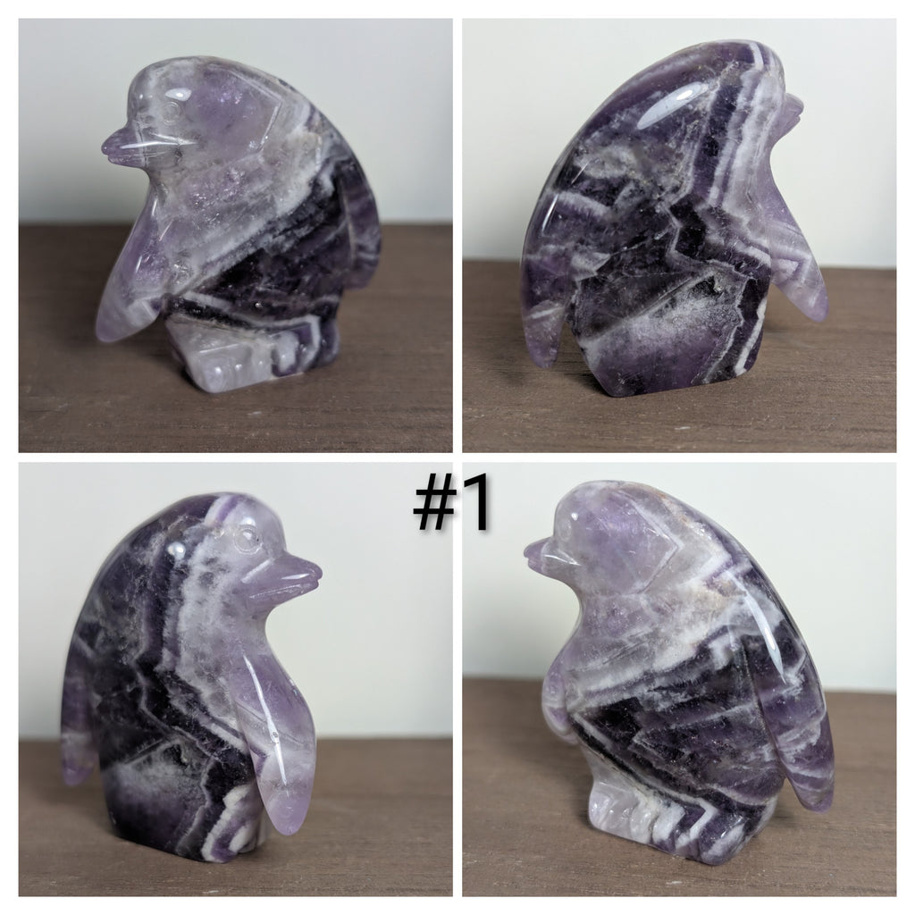 Syn's Crystal Co penguin carving sculpture showcasing a detailed, clear crystal penguin figurine on a smooth base.