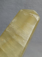 Lemon Calcite tower from Syn's Crystal Co, yellow crystal point for solar plexus chakra, confidence, motivation, and abundance.