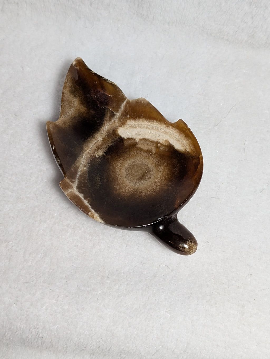Chocolate Calcite Leaf crystal from Syn's Crystal Co featuring a polished, leaf-shaped chocolate brown calcite specimen with natural texture.