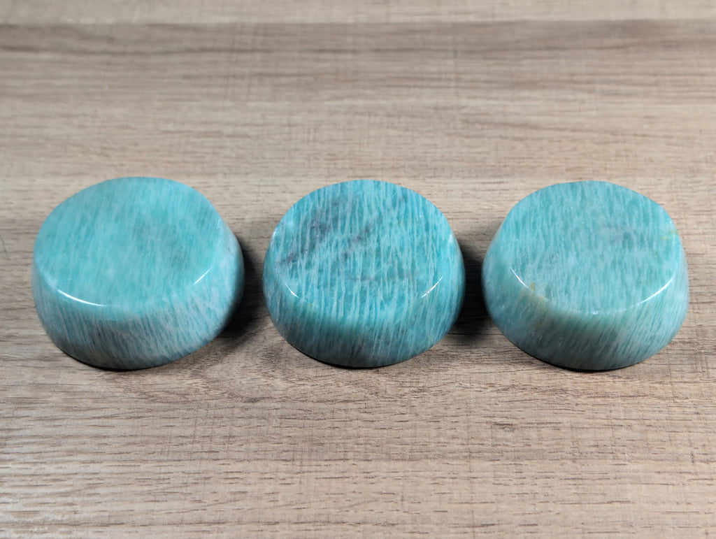 Round Amazonite bowl from Syn's Crystal Co, showcasing smooth, polished blue-green stone with natural veining and a glossy finish.