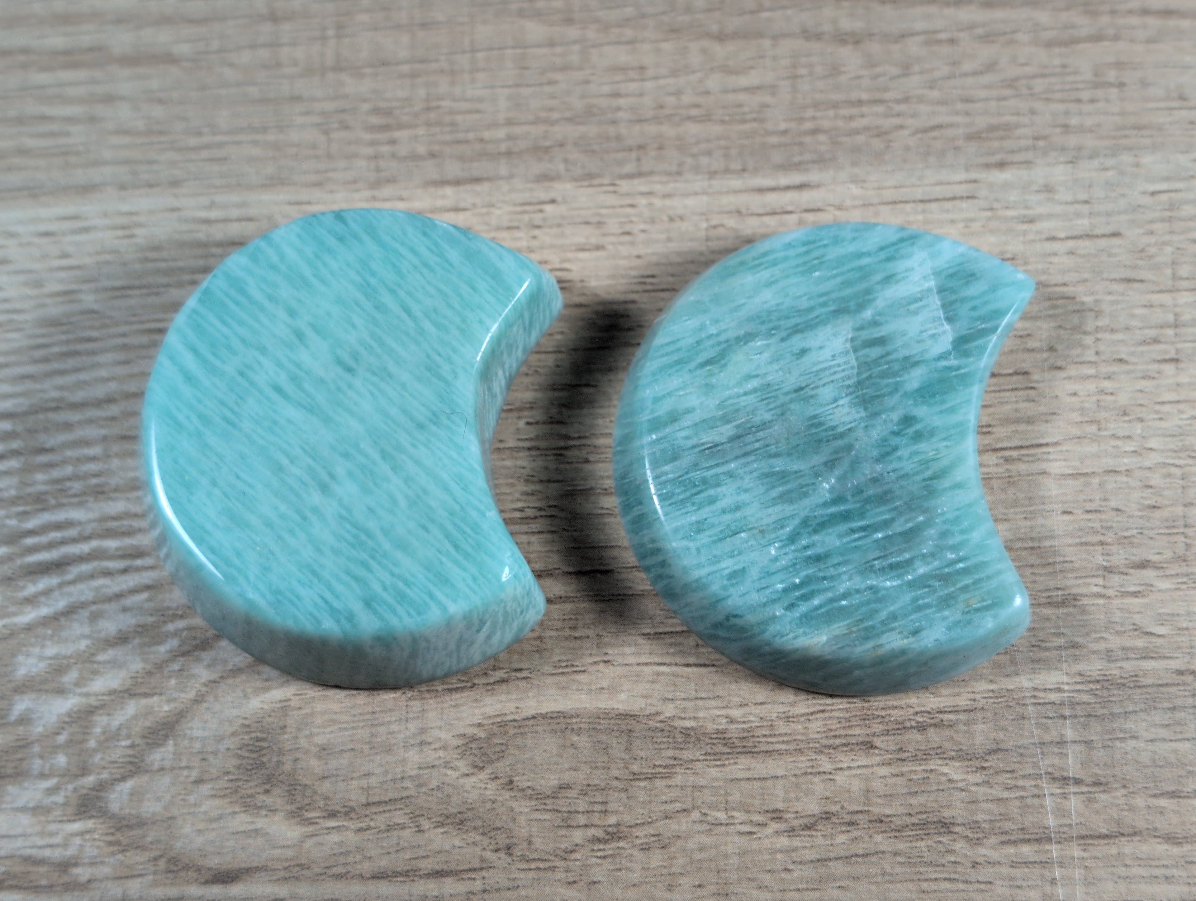 Half-moon shaped Amazonite bowl from Syn's Crystal Co, showcasing smooth polished blue-green stone with natural variations.