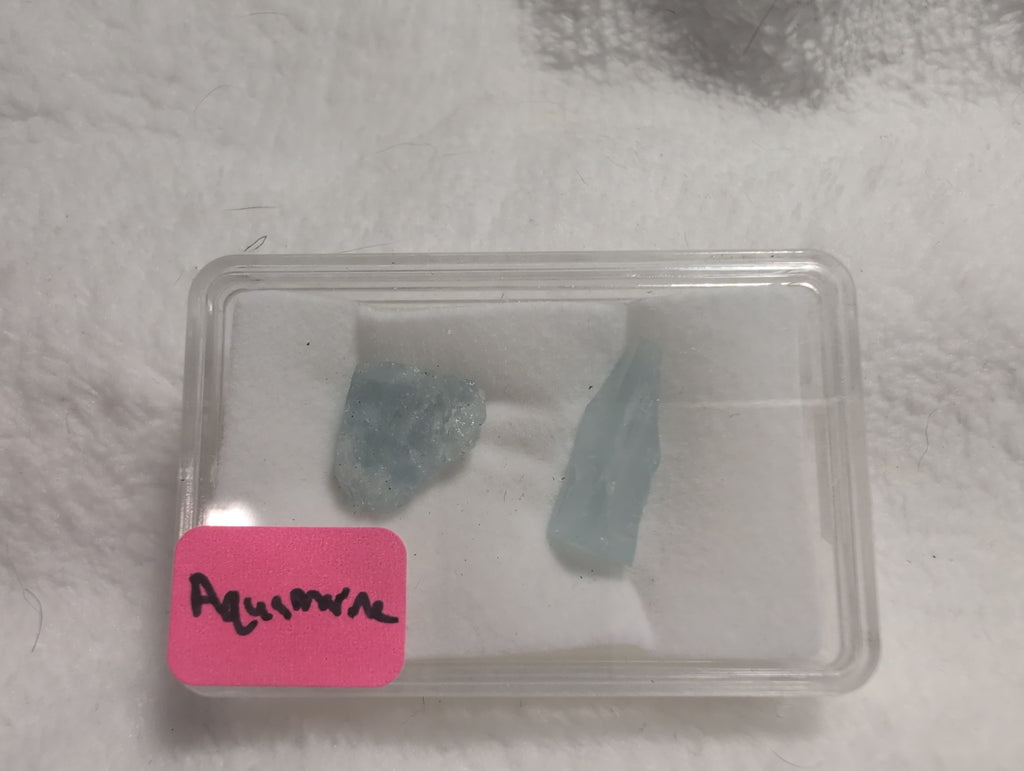 Natural raw aquamarine crystal specimen from Syn's Crystal Co, showcasing a calming blue beryl for throat chakra, clarity, and communication.