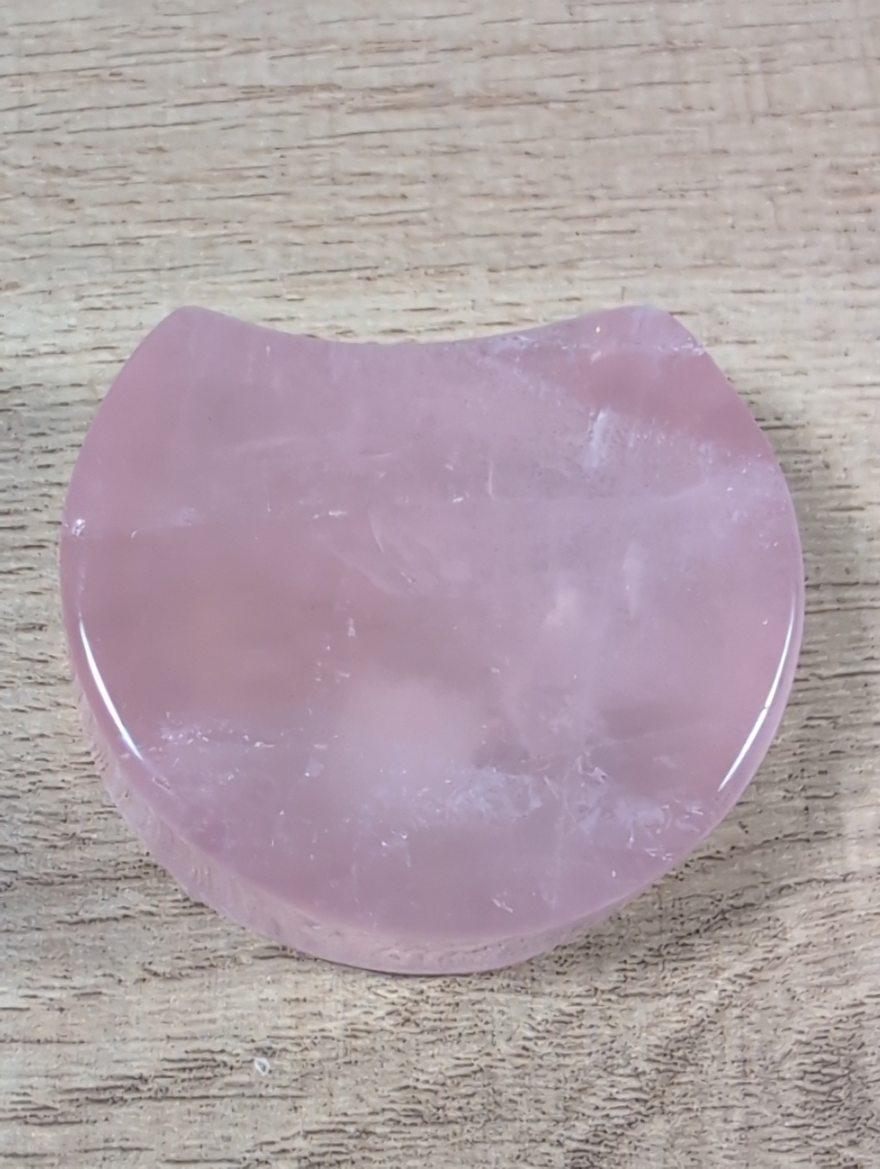 Shaped rose quartz bowl from Syn's Crystal Co, featuring smooth, polished pink quartz with a rounded, decorative design.