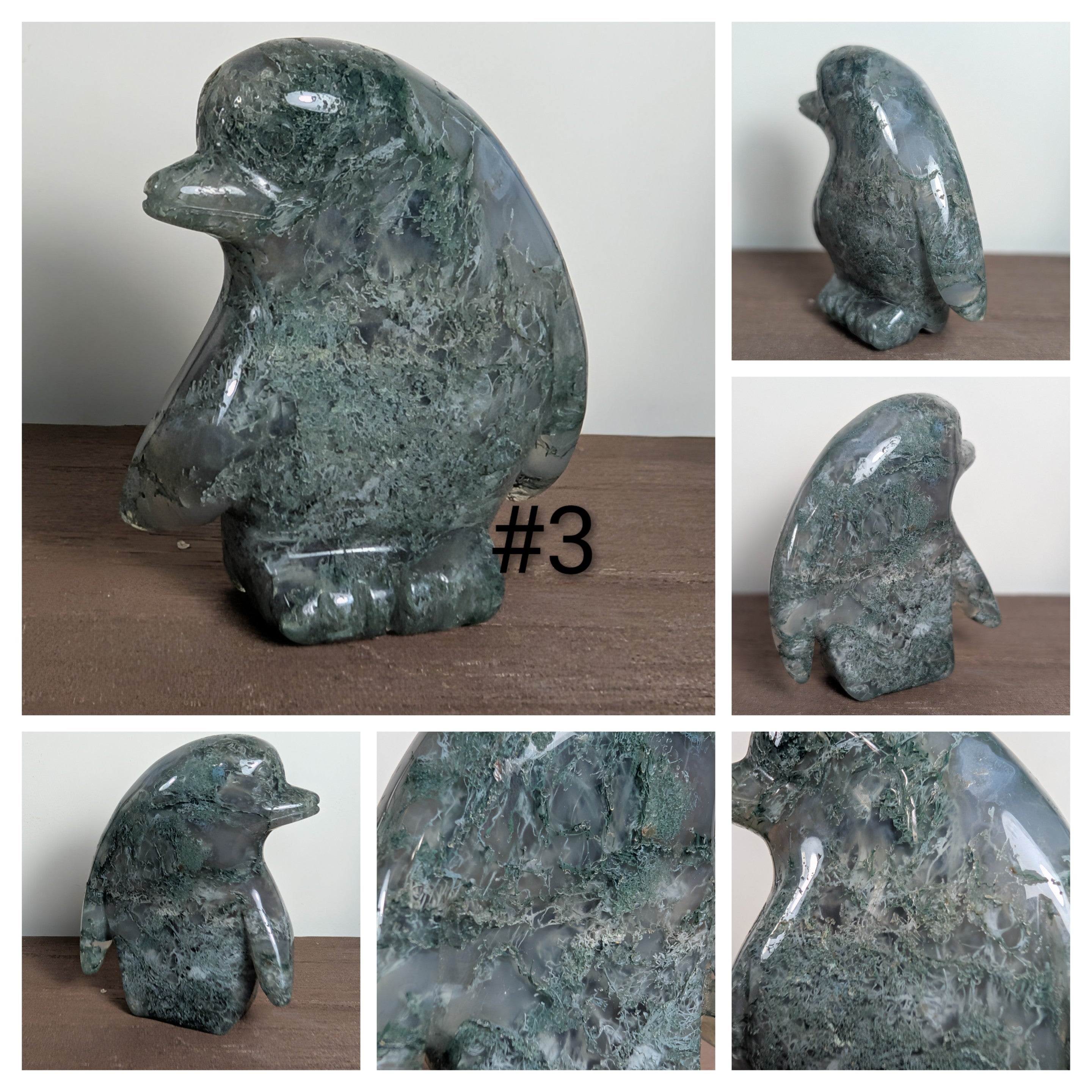 Glass penguin carving by Syn's Crystal Co, showcasing a detailed crystal penguin sculpture on a clear base.