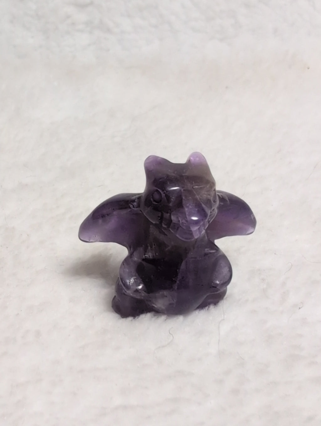 Mini Charizard Pokemon carving by Syn's Crystal Co, featuring a detailed crystal sculpture of the iconic fire-spitting dragon.