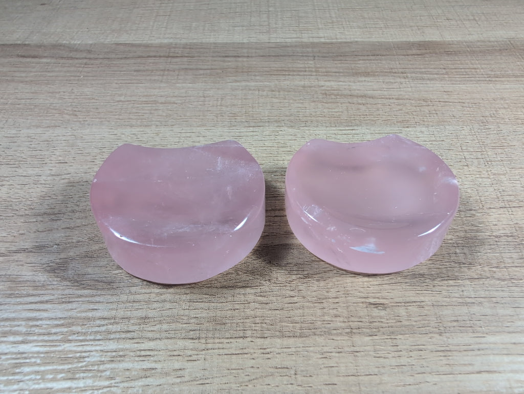 Shaped rose quartz bowl by Syn's Crystal Co, smooth polished pink gemstone with a rounded, decorative design for display or meditation.