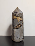 Septarian tower crystal from Syn's Crystal Co featuring earthy brown, yellow, and gray mineral patterns with a polished finish.