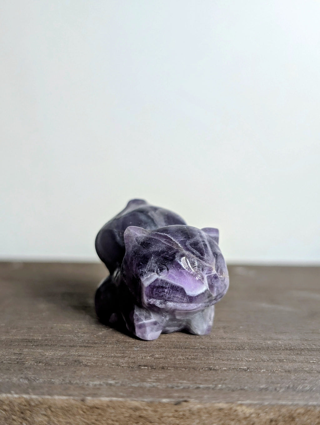 Hand-carved Bulbasaur crystal figurine from Syn's Crystal Co, showcasing detailed gemstone craftsmanship for nature and heart chakra.