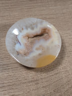 Round Flower Agate bowl from Syn's Crystal Co, showcasing colorful flower-like patterns in smooth, polished agate stone.