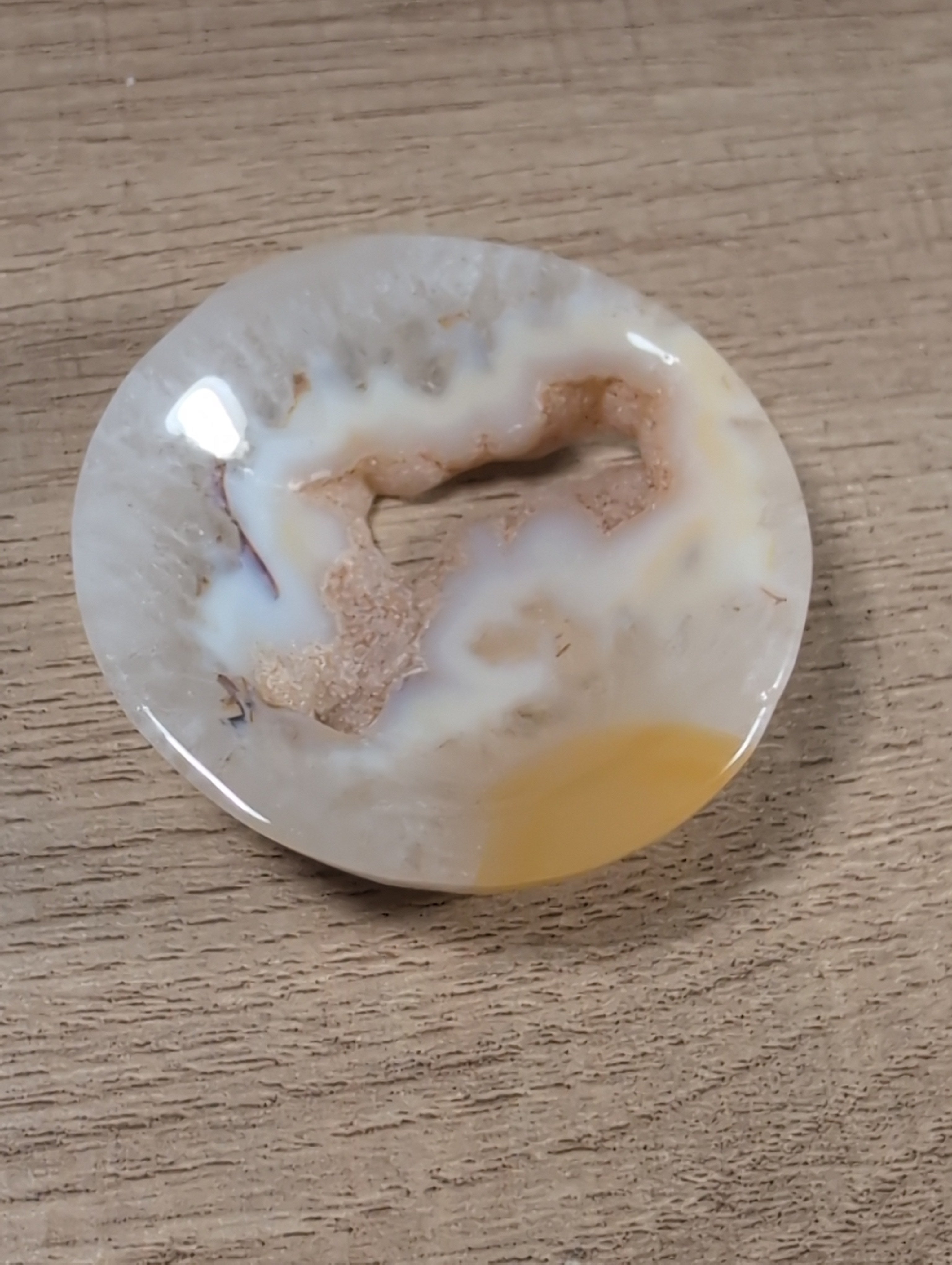 Round Flower Agate bowl from Syn's Crystal Co, showcasing colorful flower-like patterns in smooth, polished agate stone.