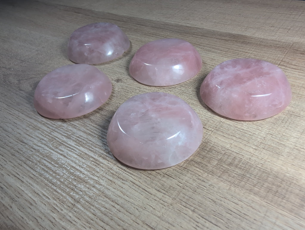 Round rose quartz bowl from Syn's Crystal Co, smooth pink gemstone with a polished surface and rounded shape.