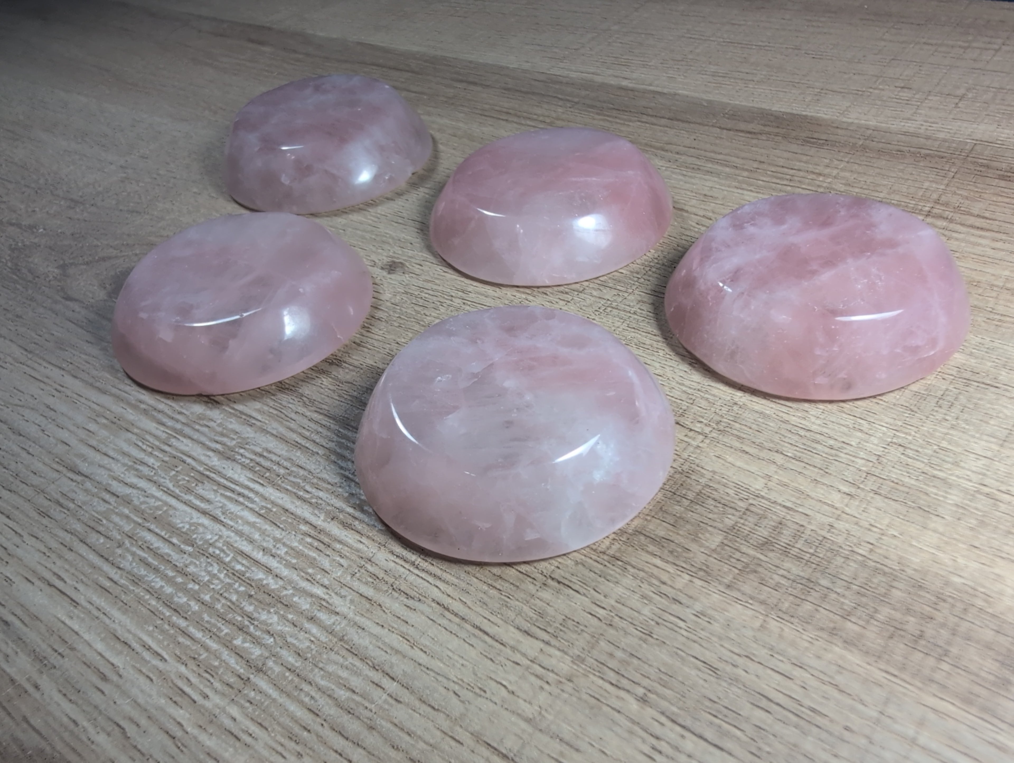 Round rose quartz bowl from Syn's Crystal Co, smooth pink gemstone with a polished surface and rounded shape.