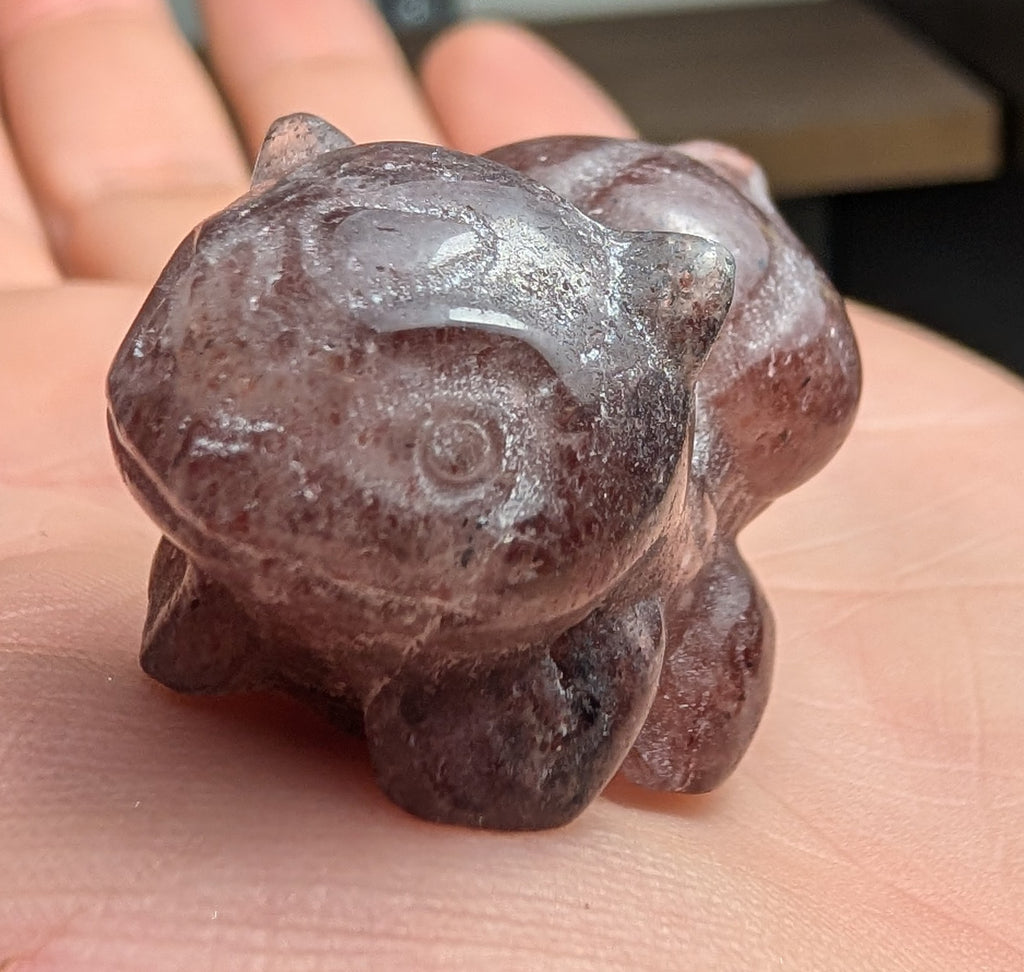 Hand-carved Bulbasaur crystal figurine by Syn's Crystal Co, gemstone collectible for growth and nature, featuring detailed craftsmanship.