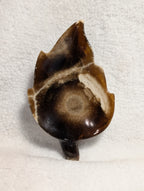 Chocolate Calcite Leaf crystal from Syn's Crystal Co, featuring a polished leaf-shaped chocolate-colored calcite specimen.