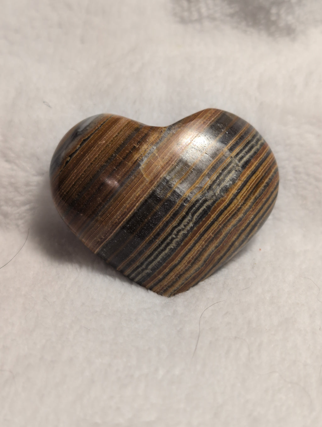 Bumblebee Calcite Heart from Syn's Crystal Co showing a polished yellow and black calcite heart with natural patterns and smooth surface.
