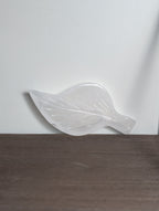 Silky white calcite leaf carving by Syn's Crystal Co, showcasing detailed natural stone craftsmanship and leaf shape.