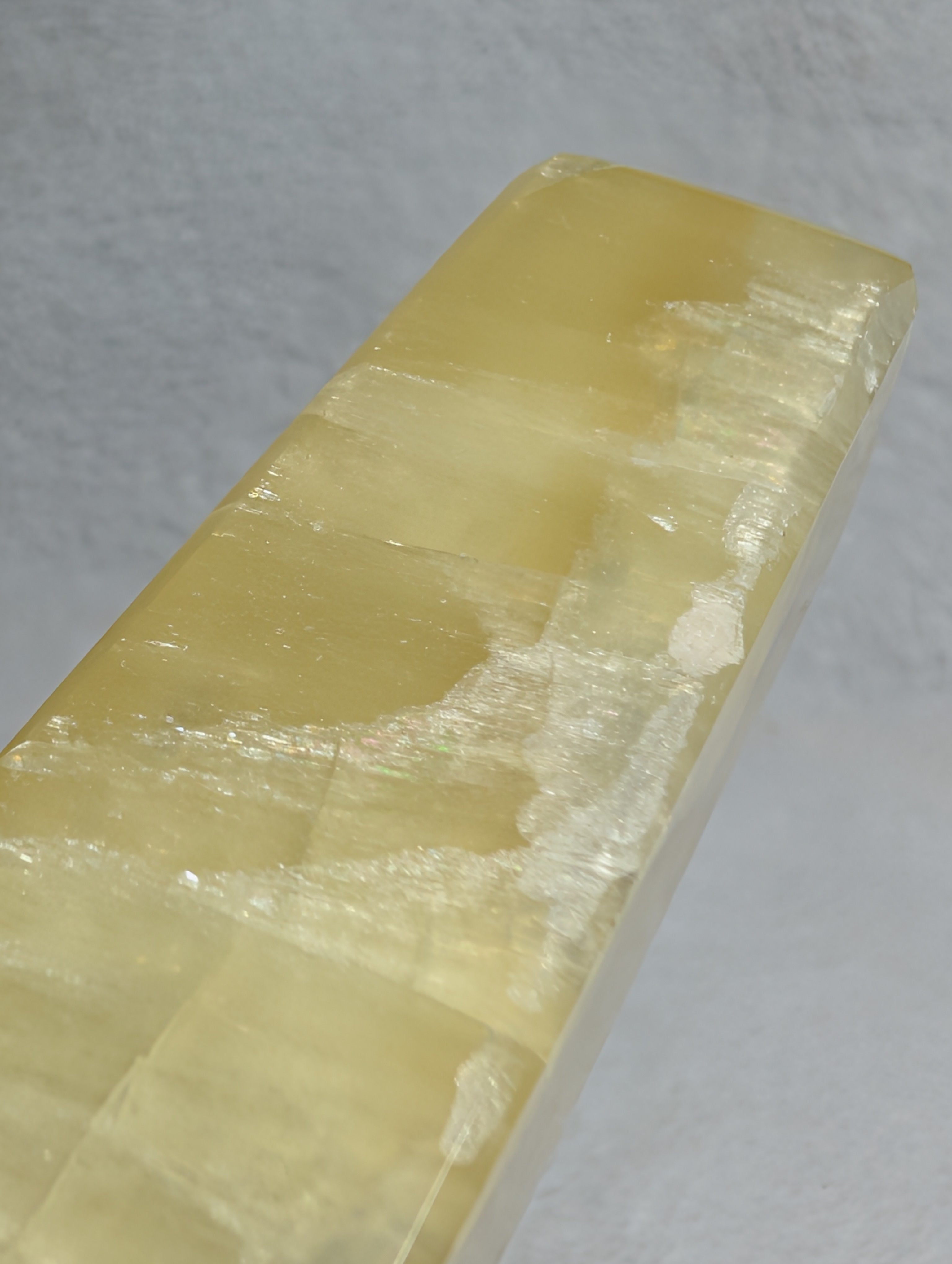 Lemon Calcite tower from Syn's Crystal Co, yellow crystal point for solar plexus chakra, confidence, motivation, and abundance.