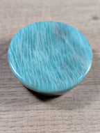 Round Amazonite bowl from Syn's Crystal Co, showcasing smooth, polished blue-green gemstone with natural mineral patterns.