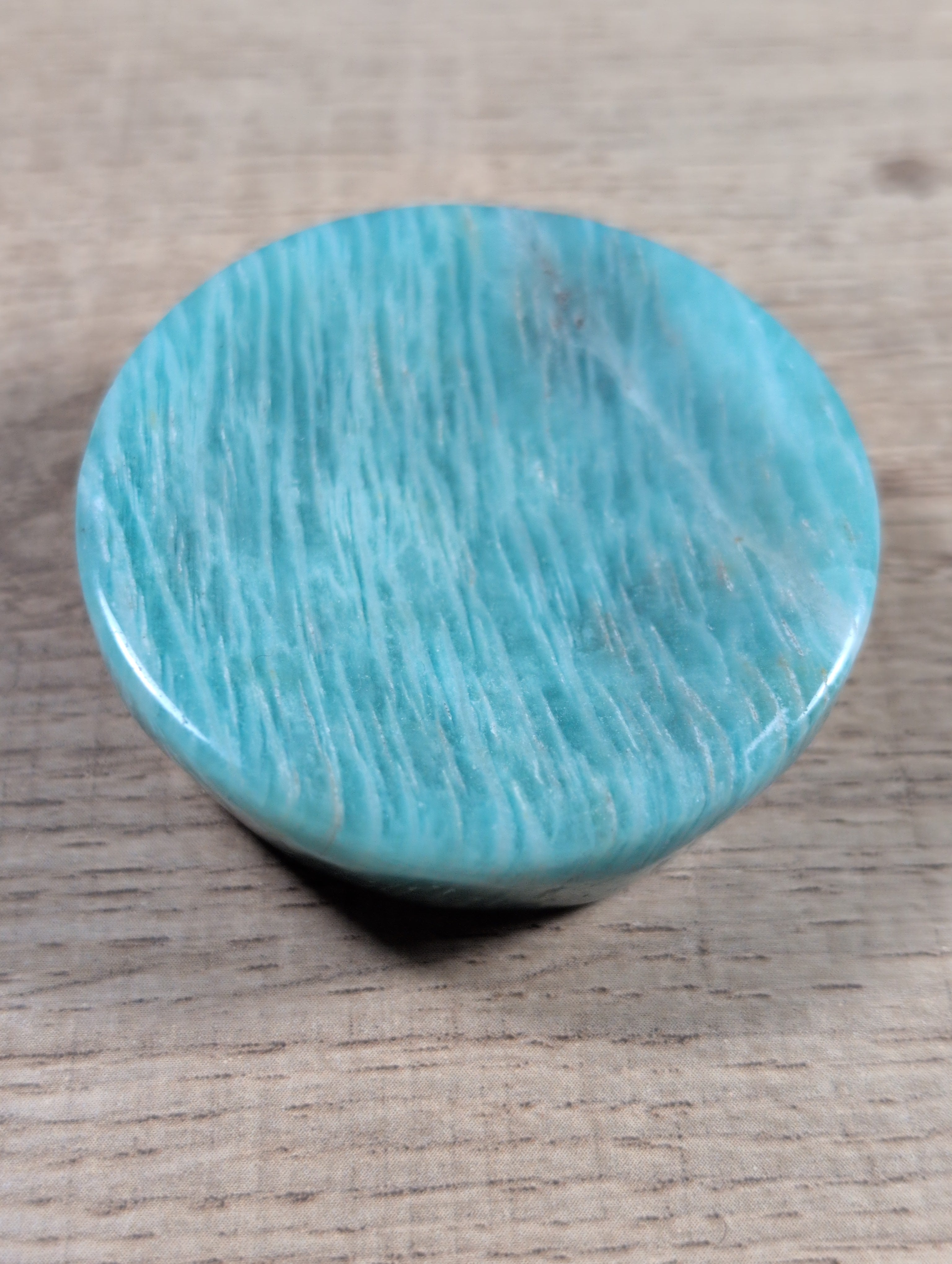 Round Amazonite bowl from Syn's Crystal Co, showcasing smooth, polished blue-green gemstone with natural mineral patterns.