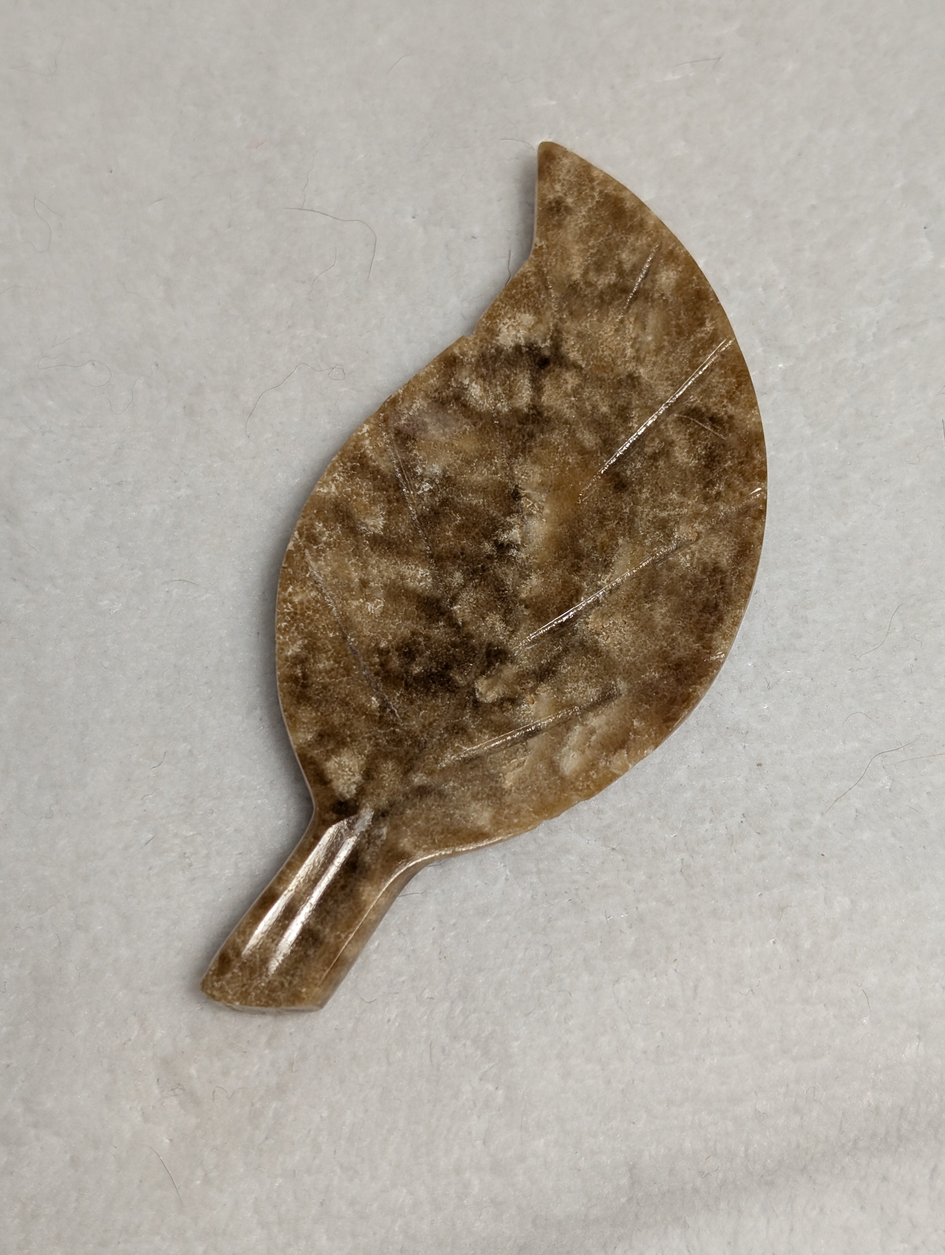 Chocolate Calcite Leaf crystal from Syn's Crystal Co, featuring a polished chocolate brown calcite leaf with natural mineral details.