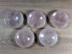 Round rose quartz bowl from Syn's Crystal Co with smooth, pink crystal surface and polished finish.