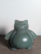 Snorlax carving by Syn's Crystal Co, detailed wooden sculpture of Snorlax from Pokémon, featuring smooth finish and intricate craftsmanship.